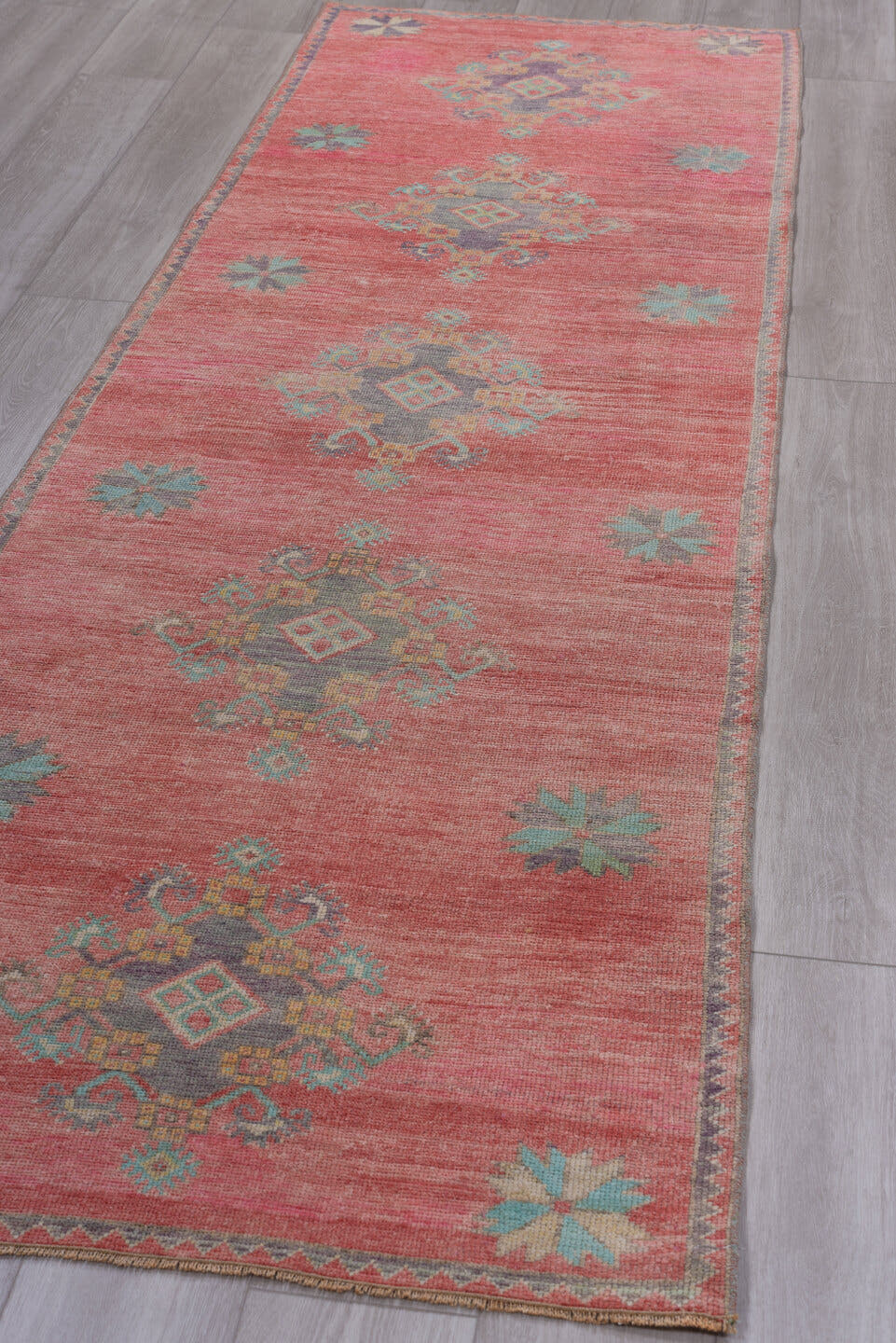 3' x 10' one-of-a-kind handmade antique Oushak runner rug. Color palette: coral, teal, slate, ivory, rose, gold, charcoal