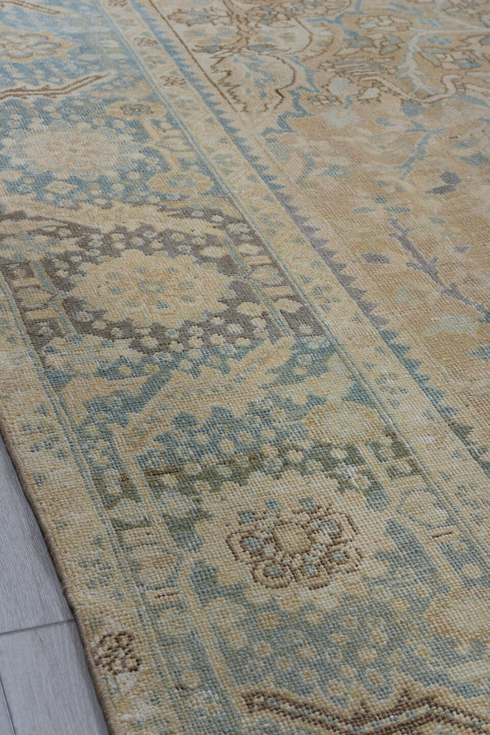 7' x 11' one-of-a-kind handmade antique Heriz large size rug. Color palette: ivory, pale blue, beige, taupe, slate, camel
