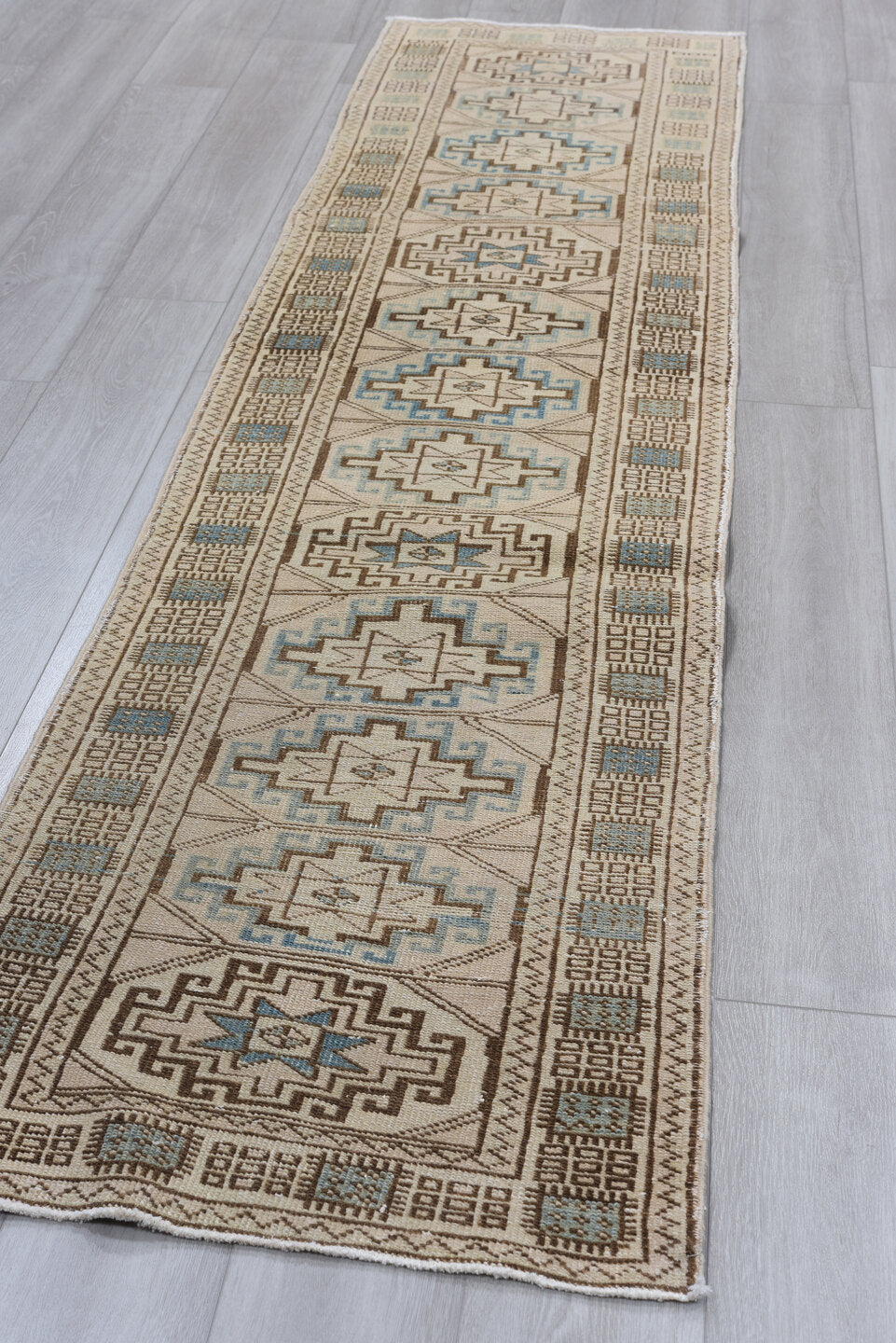 2' x 10' one-of-a-kind handmade antique Meshkin runner rug. Color palette: ivory, camel, sky blue, taupe, brown, beige