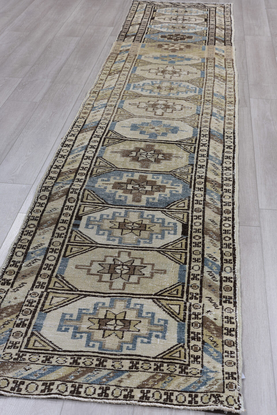 2' x 14' one-of-a-kind handmade antique Meshkin runner rug. Color palette: ivory, sky blue, taupe, brown, charcoal, beige