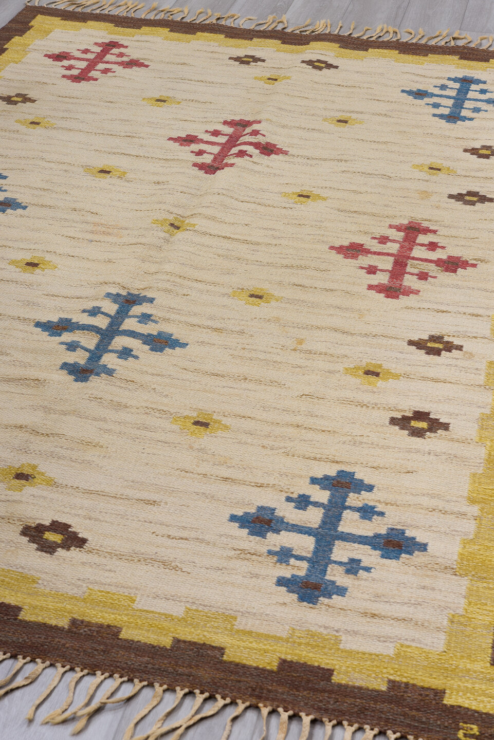 5' x 6' one-of-a-kind handmade vintage Rollaken rug. Color palette: blue, brown, gray, light gray, off-white, orange, pink