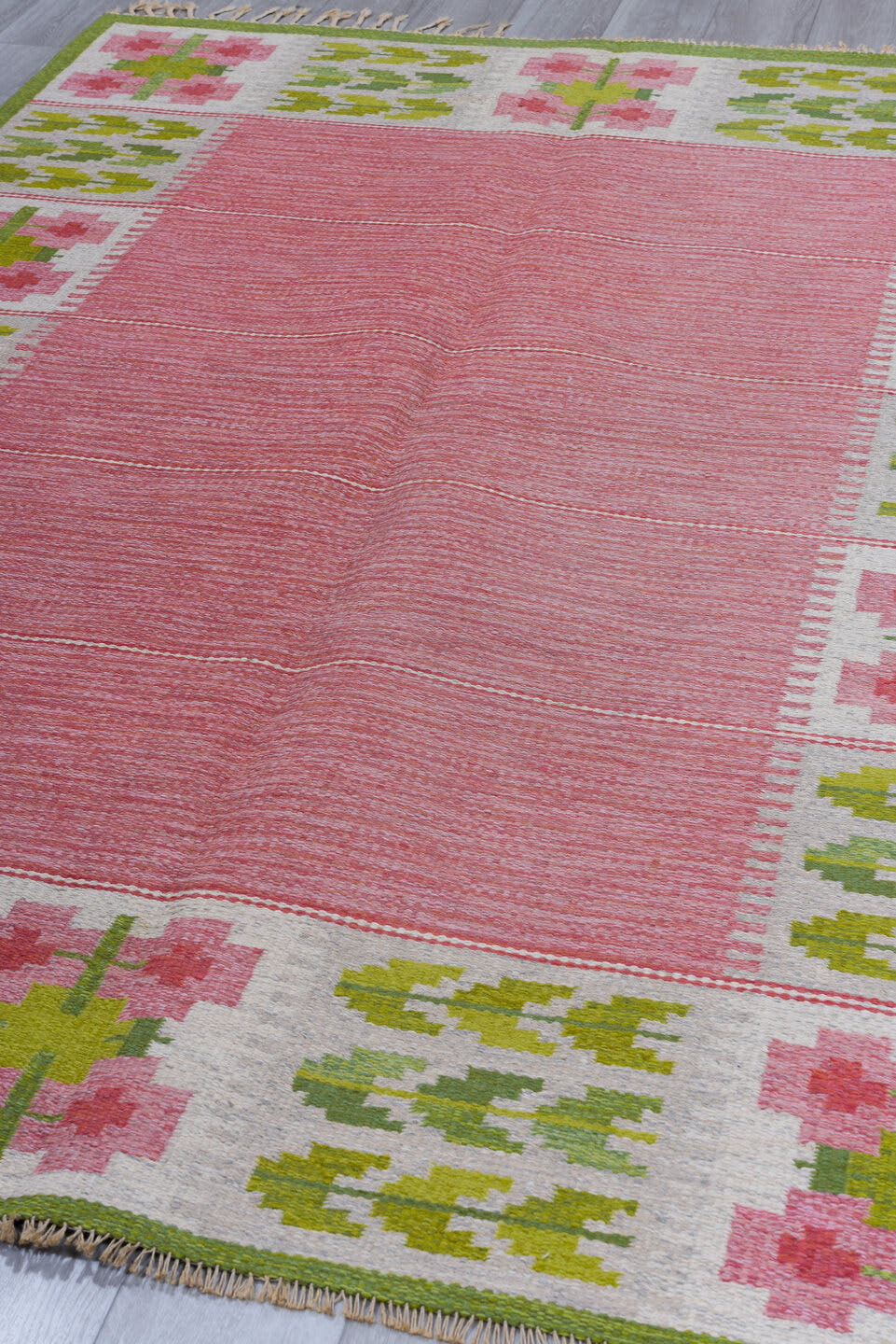6' x 9' one-of-a-kind handmade vintage Rollaken medium size rug. Color palette: rose, ivory, olive, sage, pink, red, green