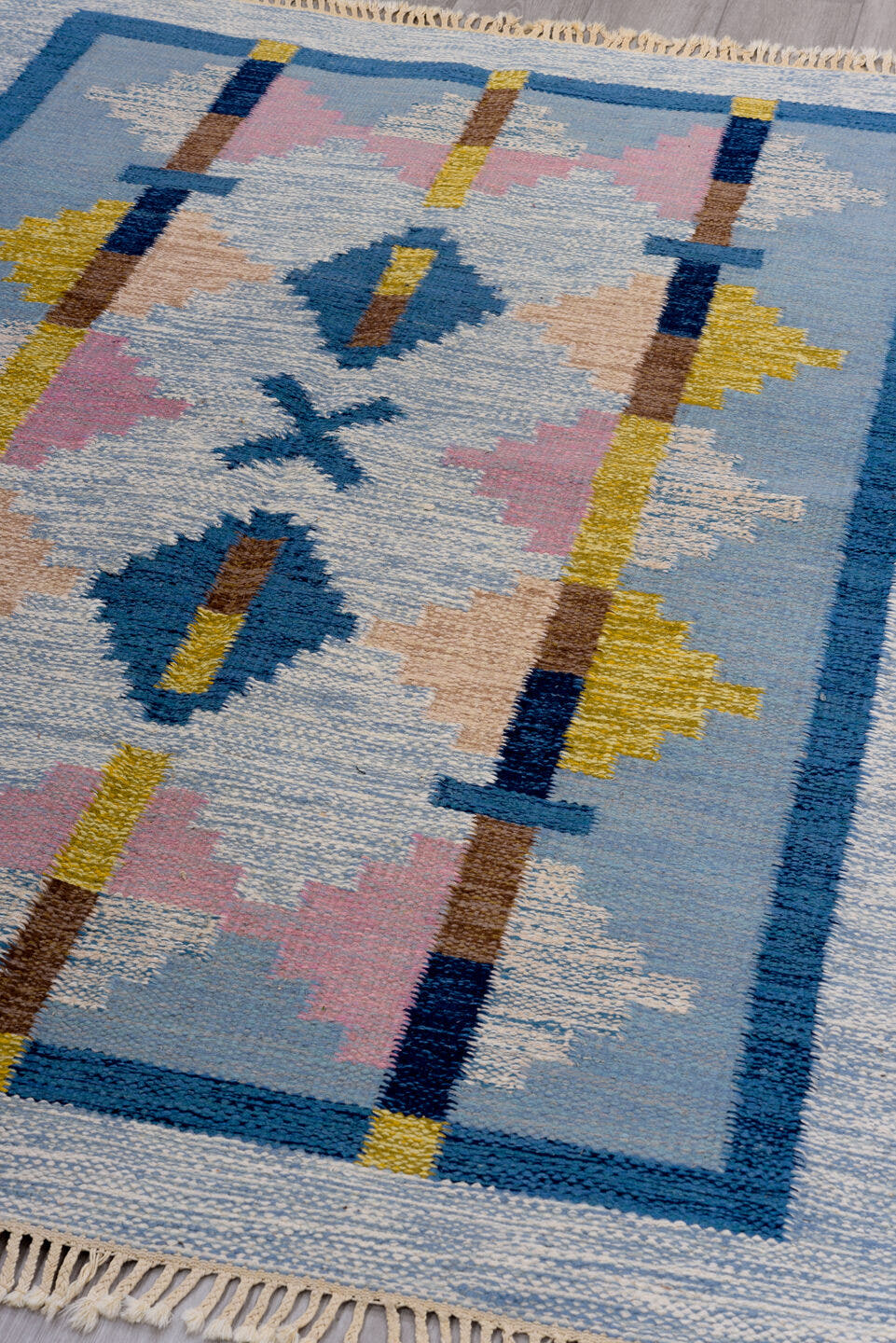 4' x 6' one-of-a-kind handmade vintage Rollaken small size rug. Color palette: light blue, ivory, blue, navy, pink, gold