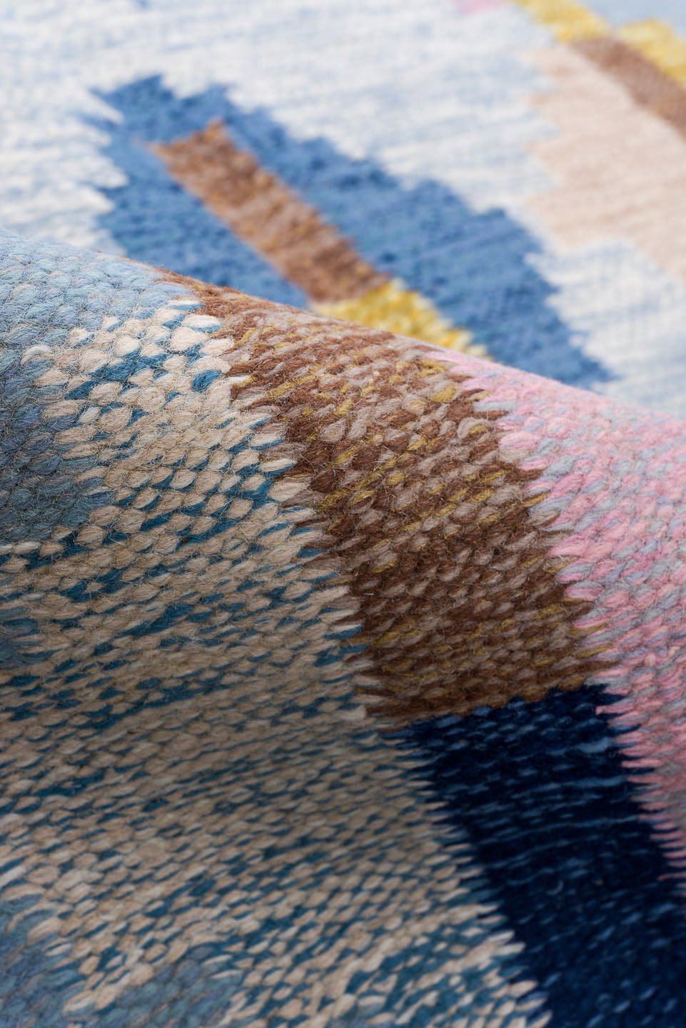 4' x 6' one-of-a-kind handmade vintage Rollaken small size rug. Color palette: light blue, ivory, blue, navy, pink, gold