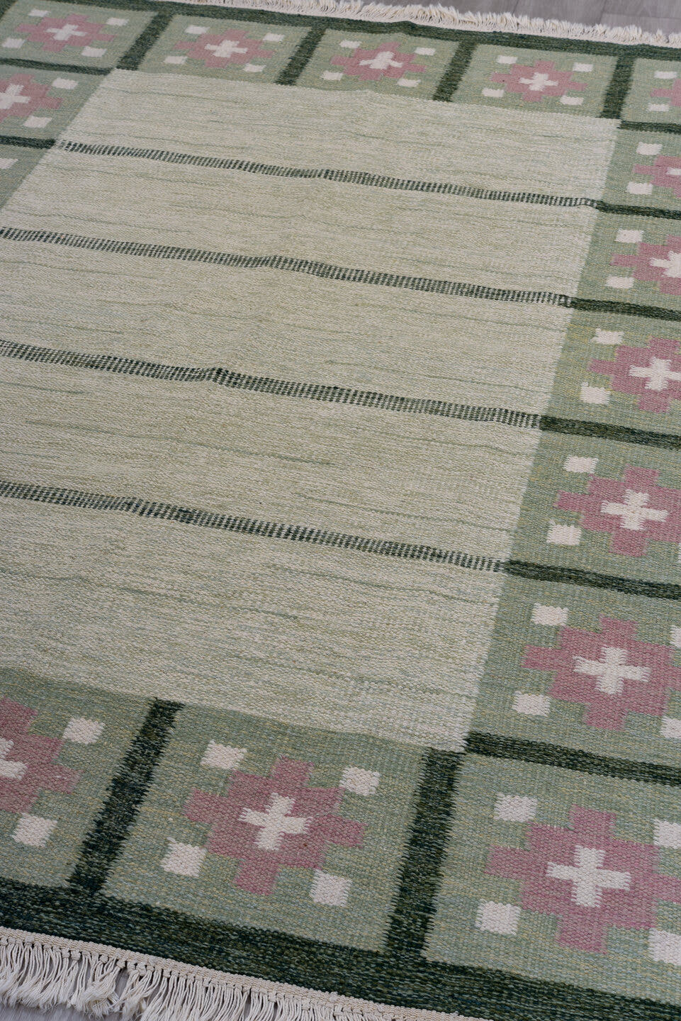 5' x 8' one-of-a-kind handmade antique Rollaken medium size rug. Color palette: ivory, sage, green, rose, cream, pink, red