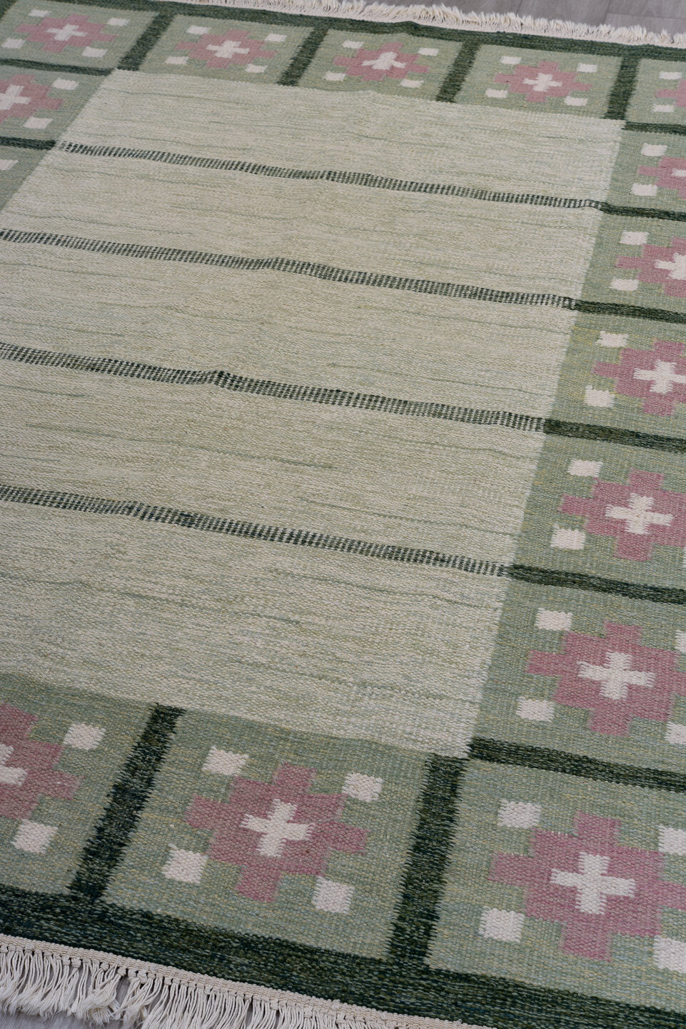 5' x 8' one-of-a-kind handmade antique Rollaken medium size rug. Color palette: ivory, sage, green, rose, cream, pink, red