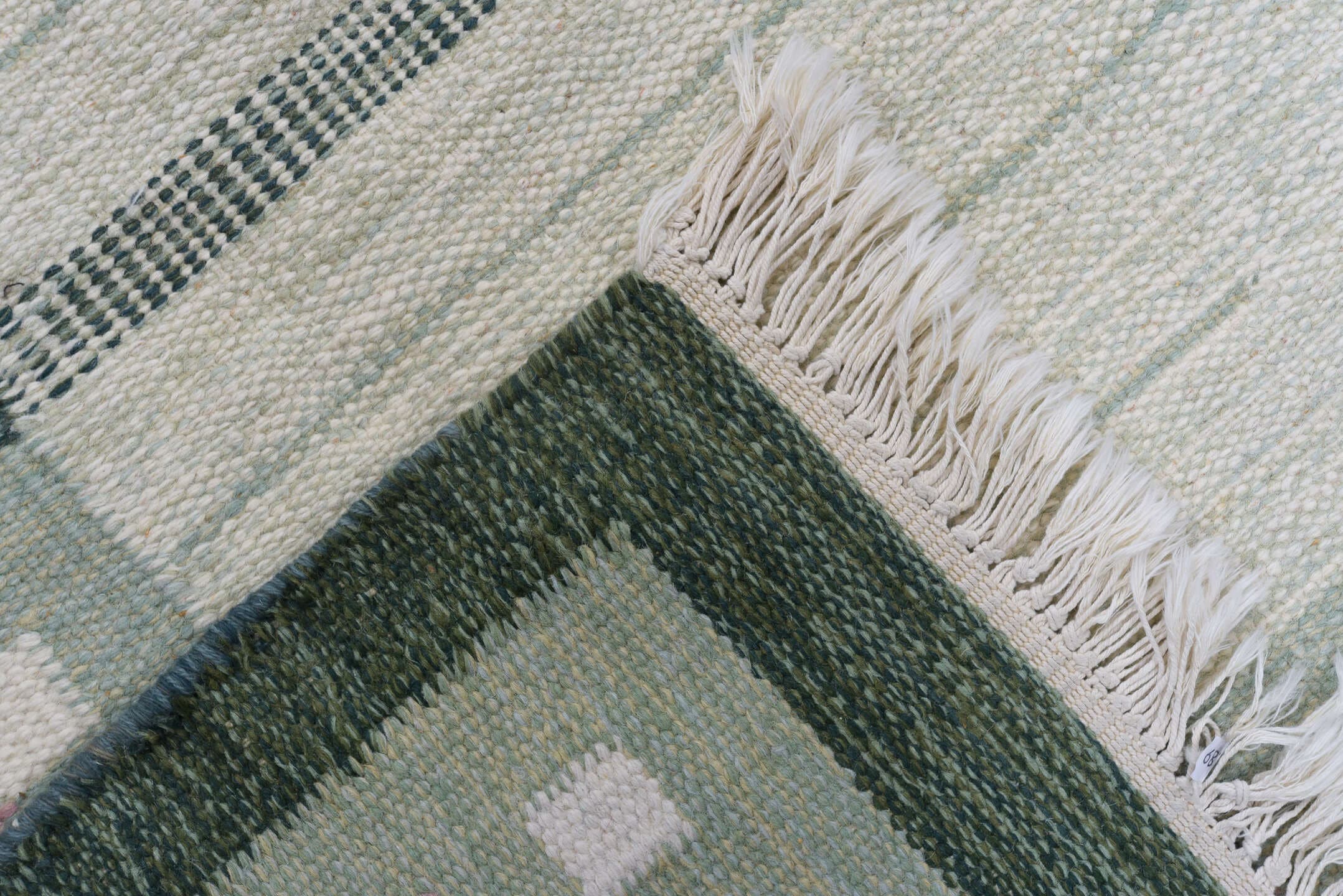5' x 8' one-of-a-kind handmade antique Rollaken medium size rug. Color palette: ivory, sage, green, rose, cream, pink, red