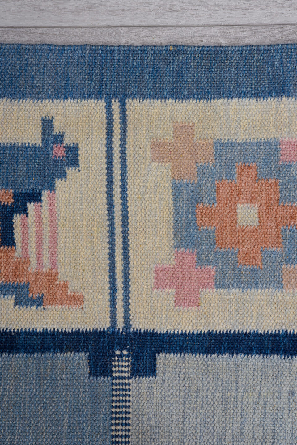 5' x 7' one-of-a-kind handmade antique Rollaken rug. Color palette: blue, ivory, navy, peach, pink, beige, terracotta