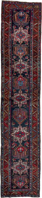 3' x 14' one-of-a-kind handmade vintage Heriz runner rug. Color palette: navy, brick red, ivory, sky blue, rust, camel
