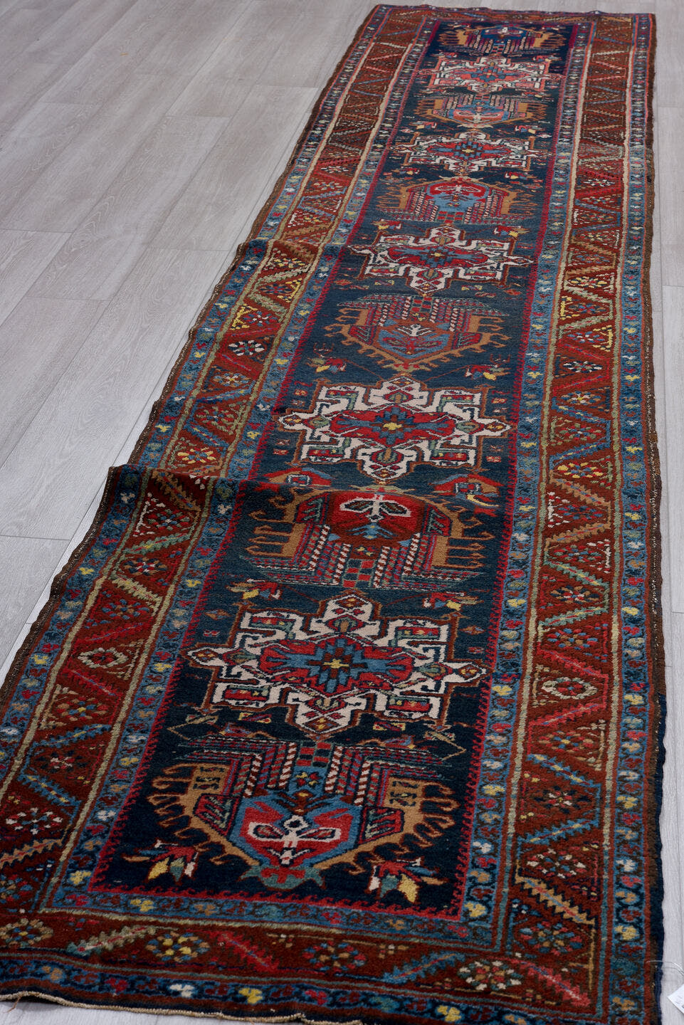 3' x 14' one-of-a-kind handmade vintage Heriz runner rug. Color palette: navy, brick red, ivory, sky blue, rust, camel