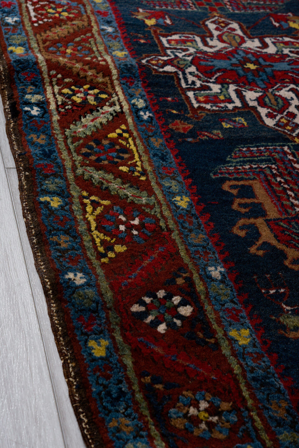 3' x 14' one-of-a-kind handmade vintage Heriz runner rug. Color palette: navy, brick red, ivory, sky blue, rust, camel