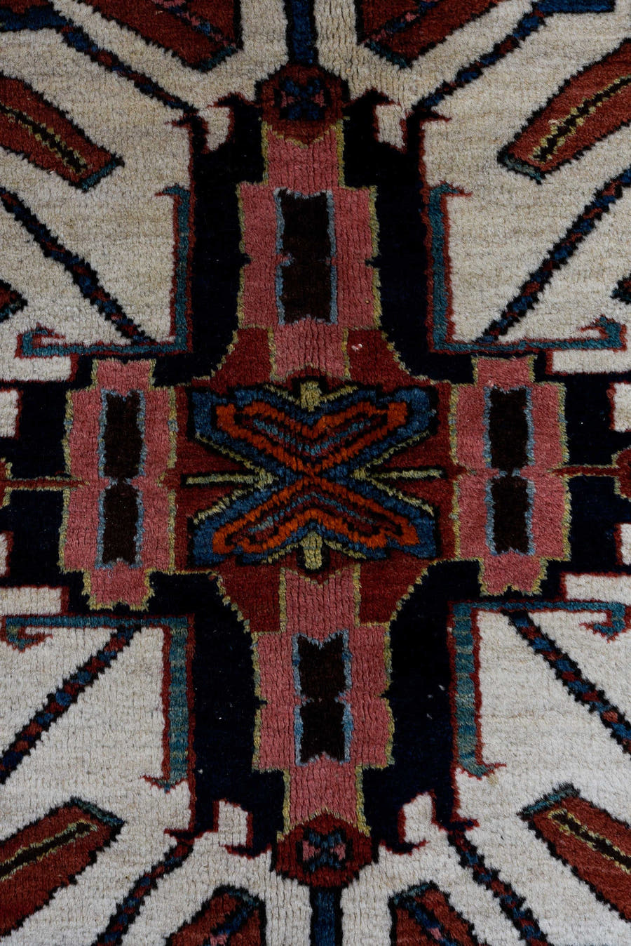 4' x 7' one-of-a-kind handmade antique Karaje rug. Color palette: rust, ivory, blue, navy, crimson, charcoal, camel, teal