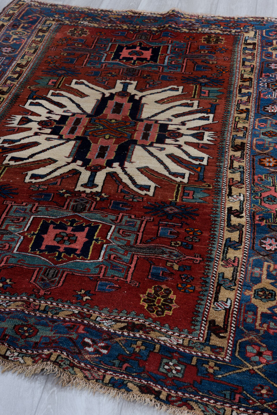 4' x 7' one-of-a-kind handmade vintage Karaje rug. Color palette: blue, brown, gray, light gray, off-white, pink, red