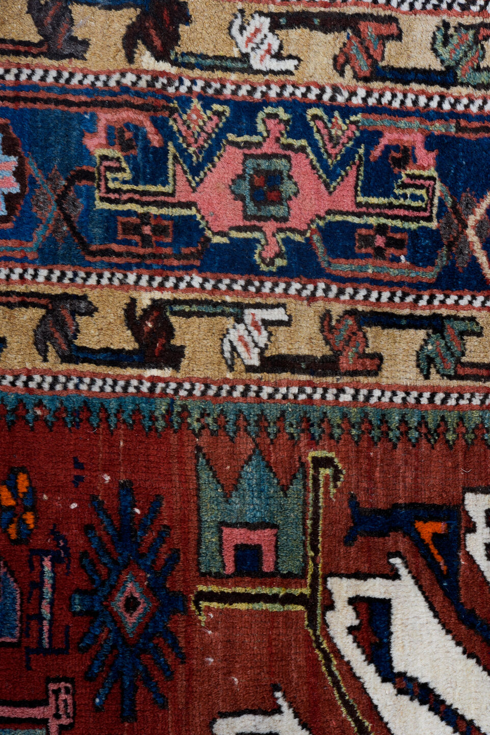 4' x 7' one-of-a-kind handmade vintage Karaje rug. Color palette: blue, brown, gray, light gray, off-white, pink, red