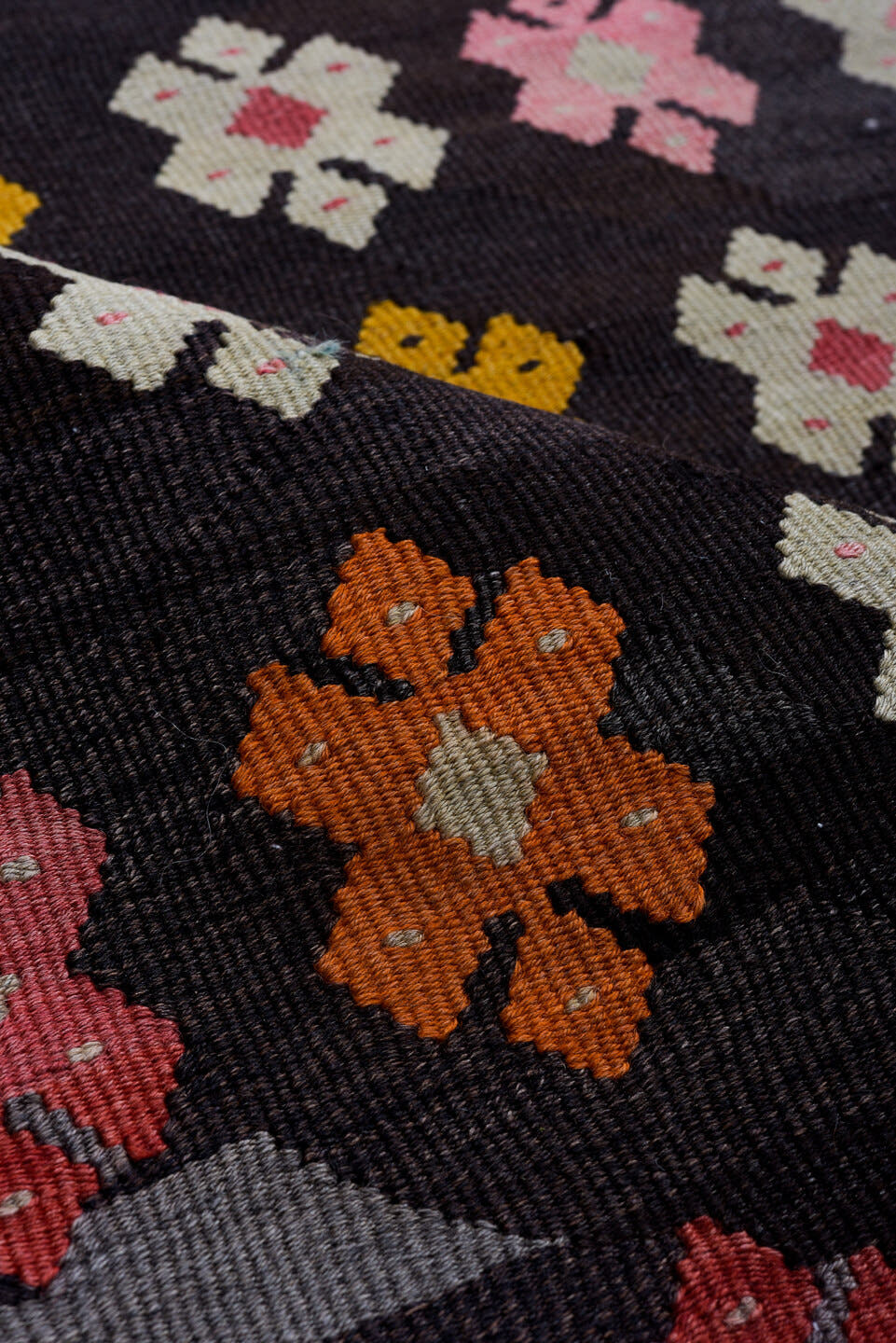 7' x 8' one-of-a-kind handmade antique Kilim rug. Color palette: charcoal, rose, ivory, rust, crimson, saffron, gray, black