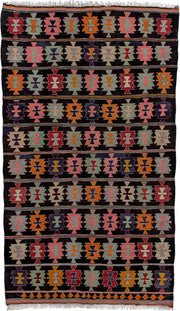 5' x 9' one-of-a-kind handmade antique Kilim medium size rug. Color palette: charcoal, rose, ivory, rust, sage, indigo