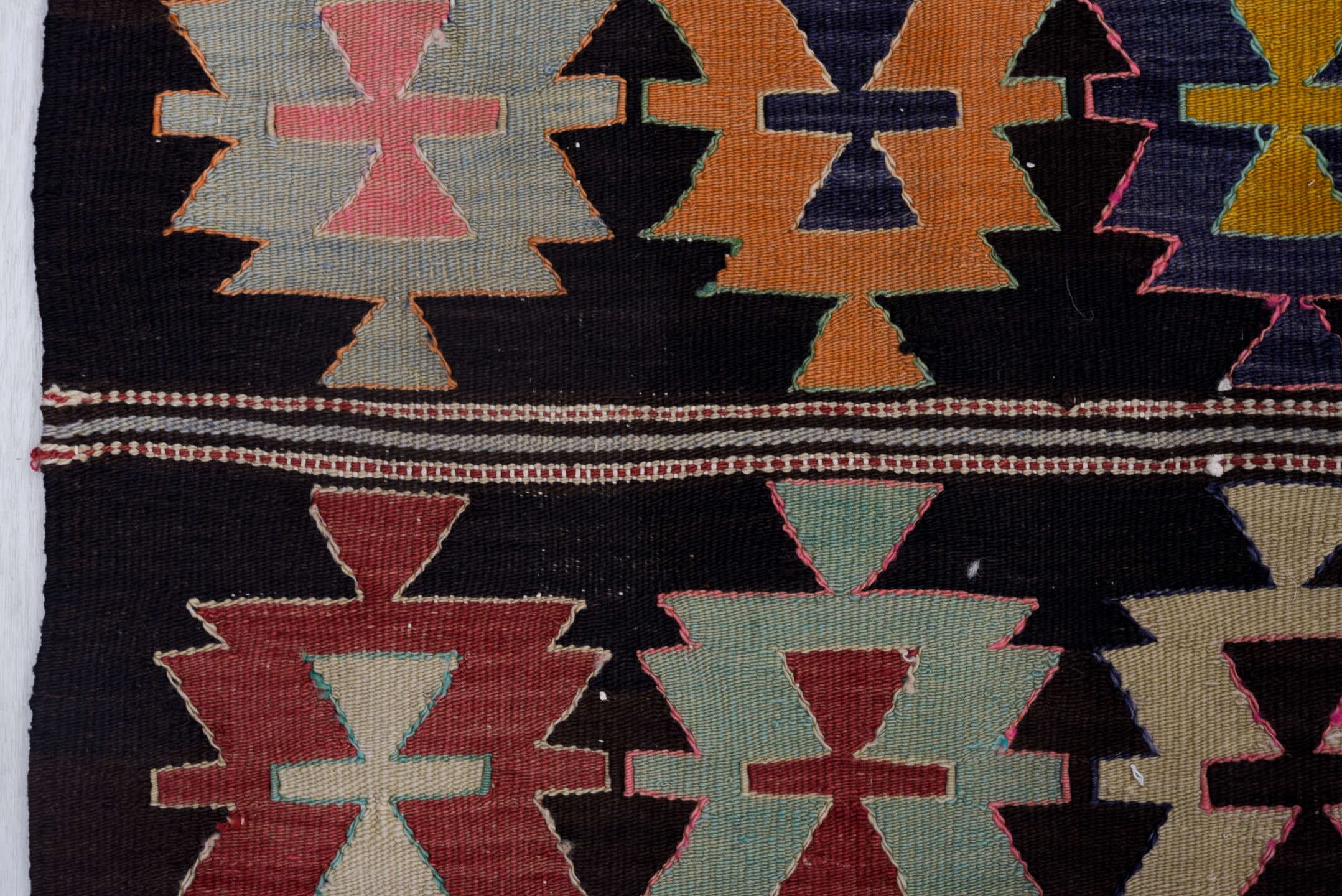 5' x 9' one-of-a-kind handmade antique Kilim medium size rug. Color palette: charcoal, rose, ivory, rust, sage, indigo