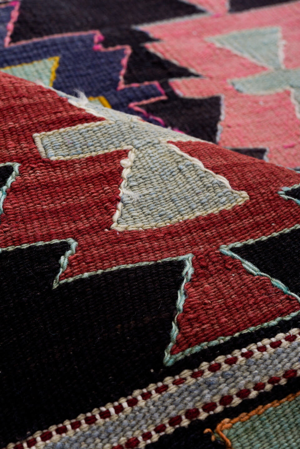 5' x 9' one-of-a-kind handmade antique Kilim medium size rug. Color palette: charcoal, rose, ivory, rust, sage, indigo