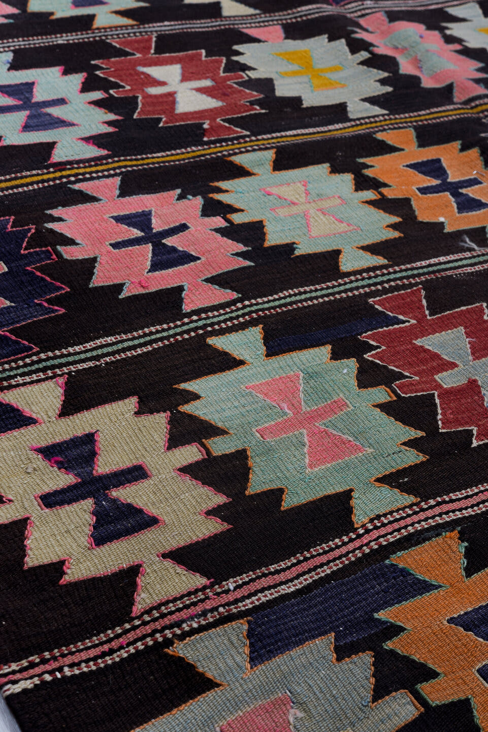 5' x 9' one-of-a-kind handmade antique Kilim medium size rug. Color palette: charcoal, rose, ivory, rust, sage, indigo