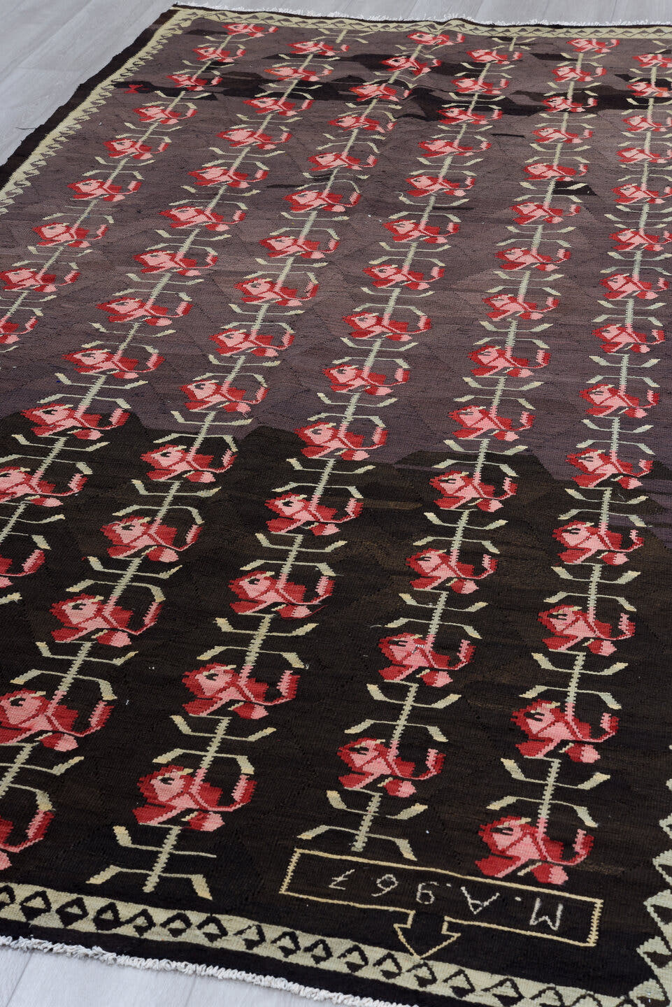 5' x 11' one-of-a-kind handmade antique Besserabian rug. Color palette: charcoal, taupe, crimson, rose, ivory, black, gray