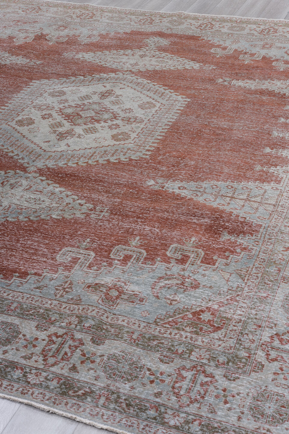 10' x 12' one-of-a-kind handmade antique Veece large size rug. Color palette: terra cotta, ivory, pale blue, taupe, rust