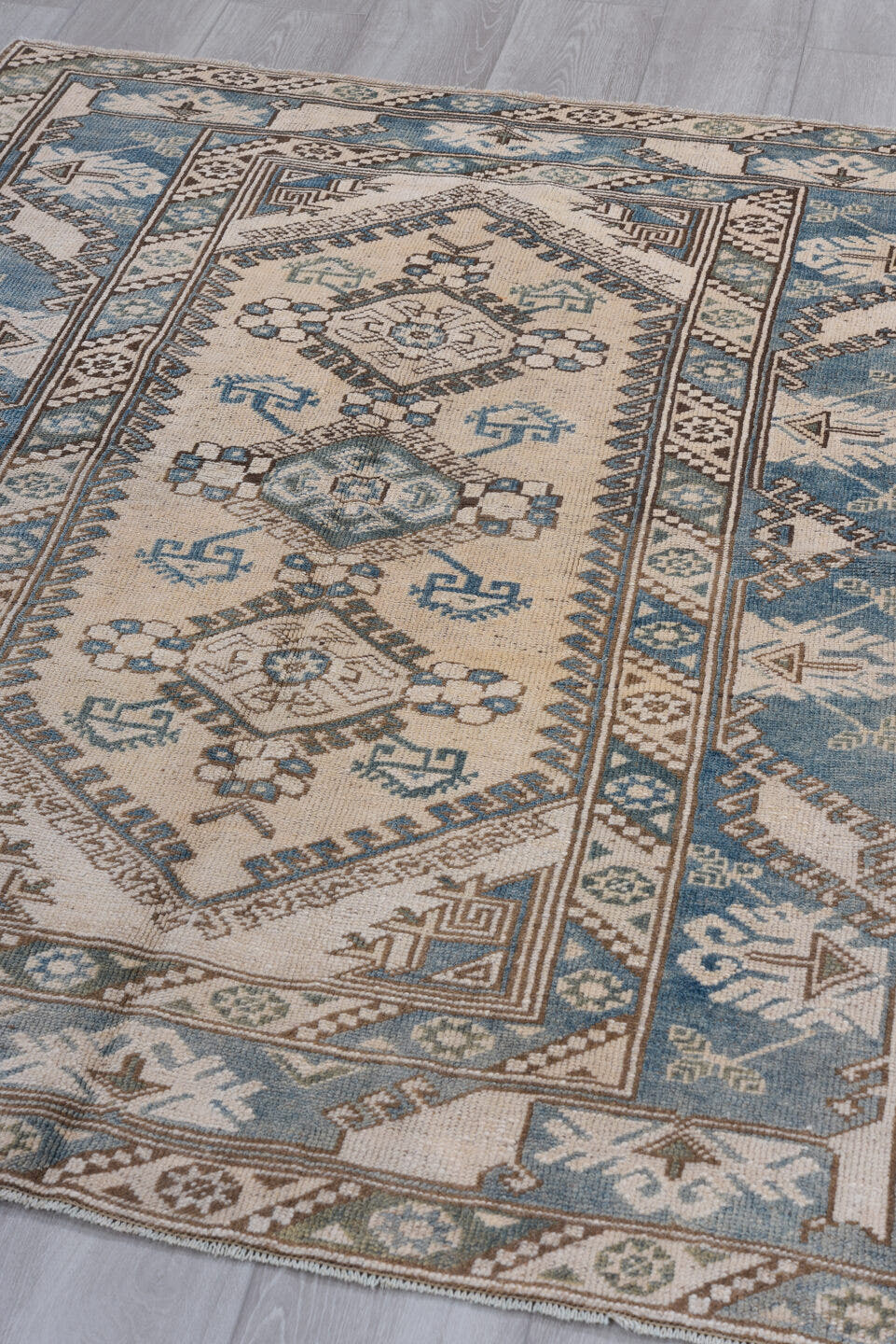 4' x 5' one-of-a-kind handmade vintage Oushak small size rug. Color palette: ivory, sky blue, taupe, brown, pale blue