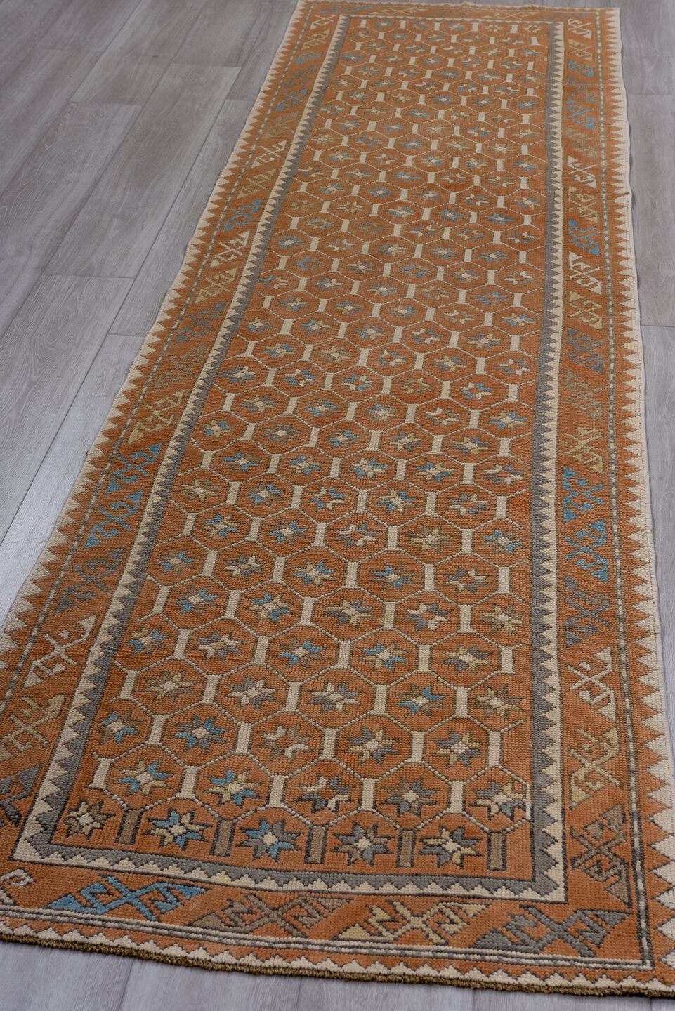 3' x 11' one-of-a-kind handmade antique Oushak runner rug. Color palette: terra cotta, ivory, sky blue, taupe, camel, brown