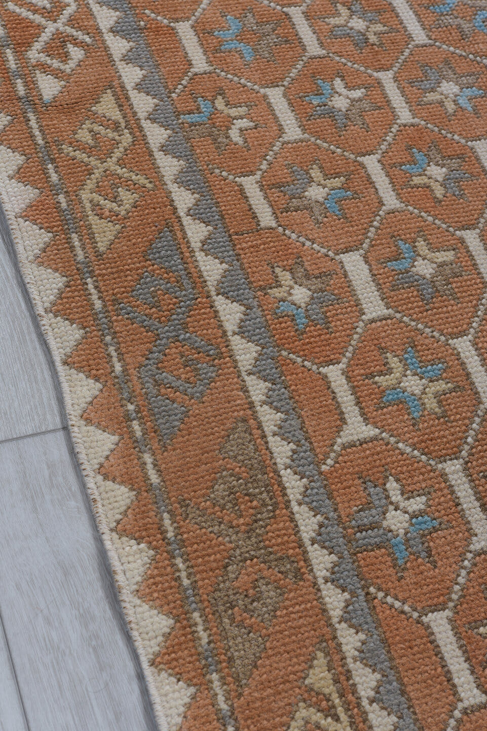 3' x 11' one-of-a-kind handmade antique Oushak runner rug. Color palette: terra cotta, ivory, sky blue, taupe, camel, brown
