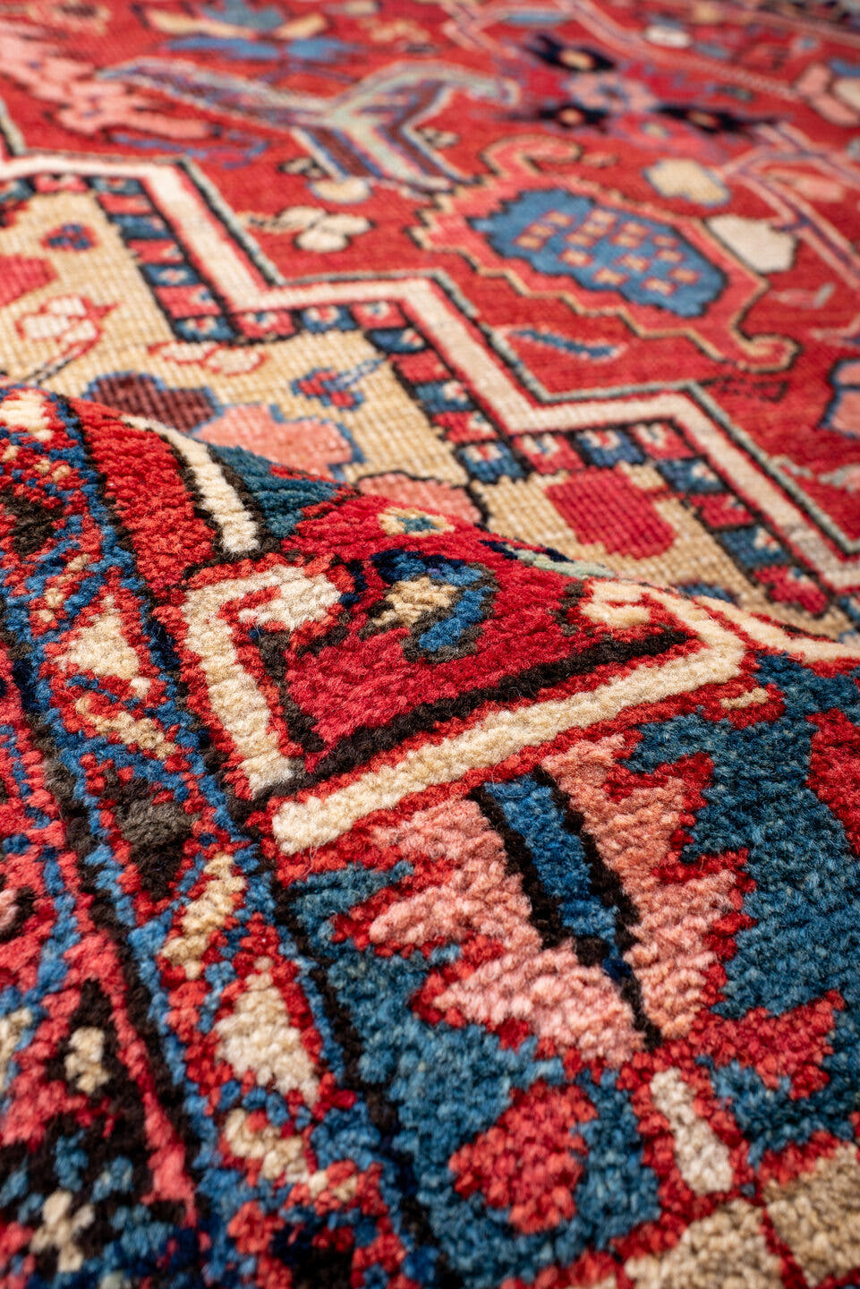 11' x 14' one-of-a-kind handmade vintage Heriz oversize rug. Color palette: red, navy, ivory, sky blue, coral, camel, pink
