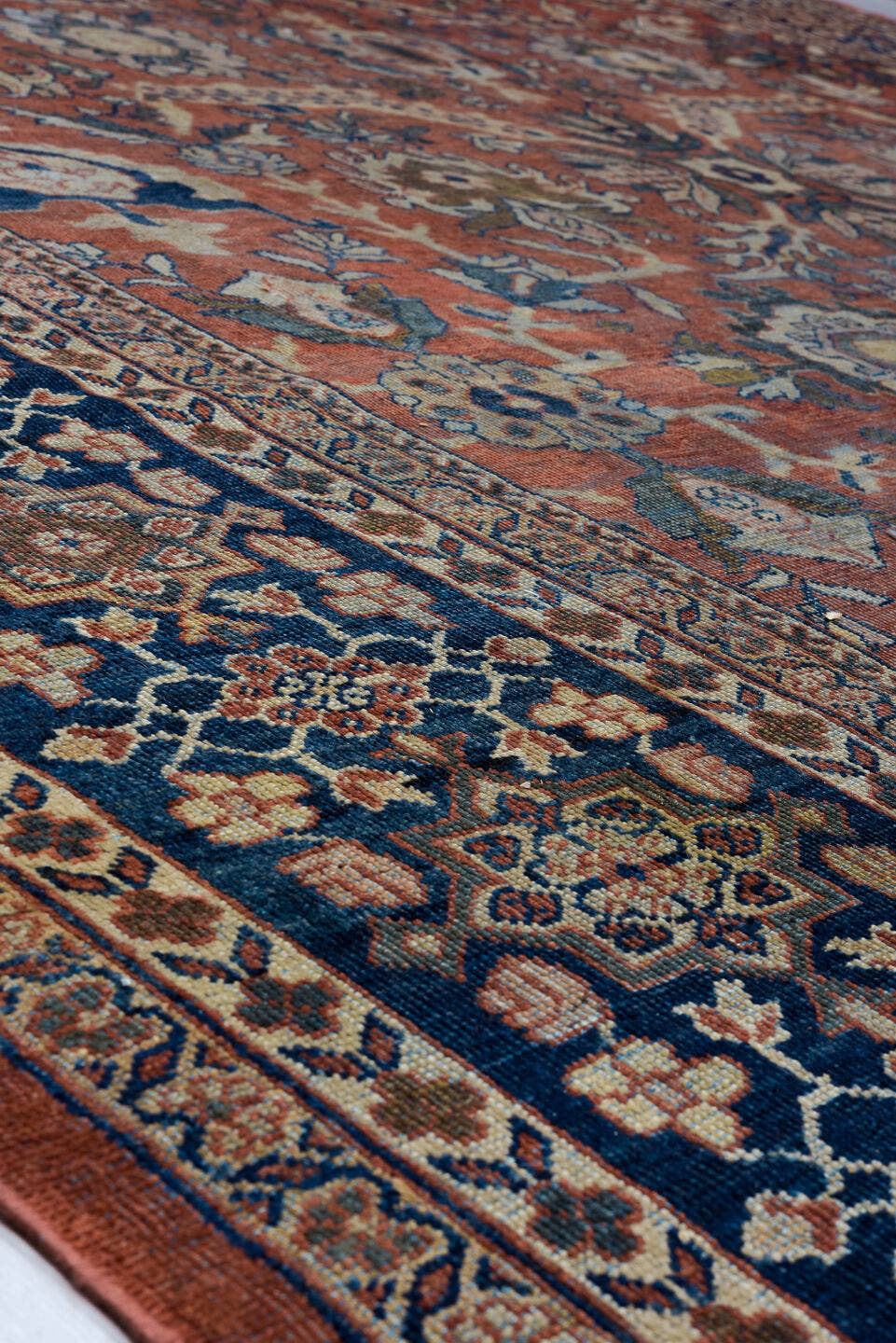 12' x 18' one-of-a-kind handmade antique Sultanabad oversize rug. Color palette: terra cotta, navy, ivory, slate, rust