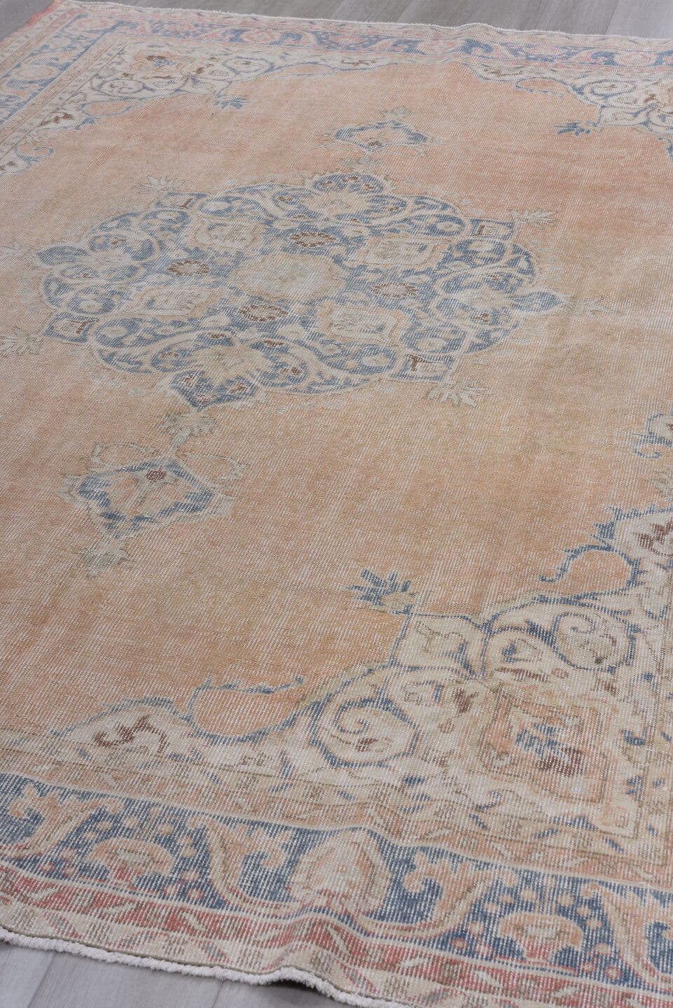 7' x 10' one-of-a-kind handmade antique Sparta large size rug. Color palette: apricot, dusty blue, ivory, rose, taupe, beige