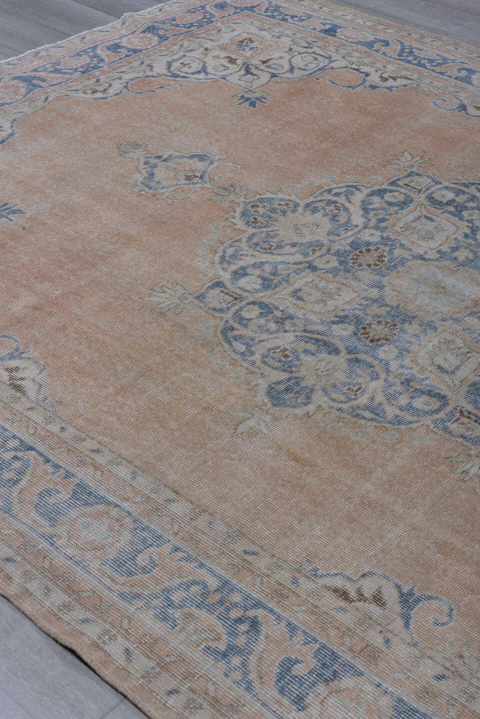 7' x 10' one-of-a-kind handmade antique Sparta large size rug. Color palette: apricot, dusty blue, ivory, rose, taupe, beige