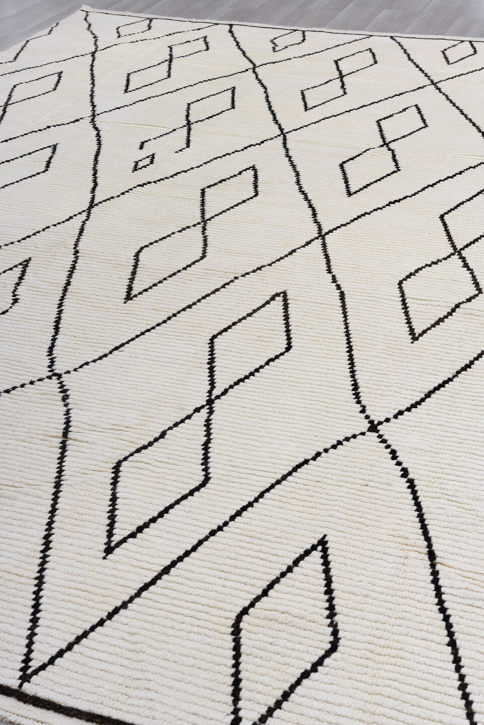 9' x 13' one-of-a-kind handmade vintage Tulu large size rug. Color palette: black, brown, gray, light gray, linen, off-white