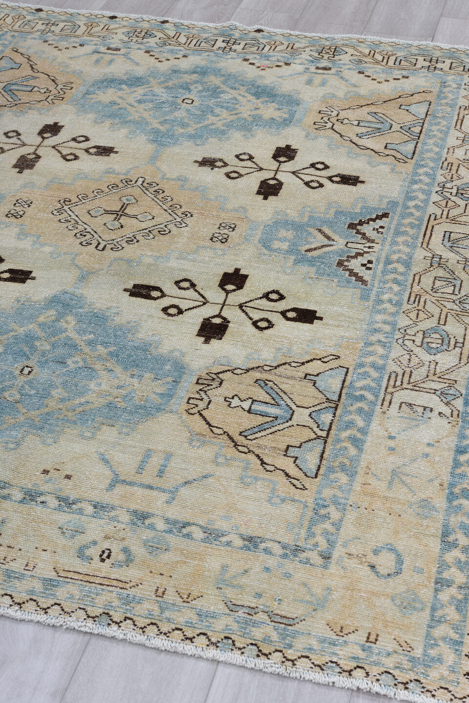 5' x 6' one-of-a-kind handmade antique Baktiary rug. Color palette: ivory, sky blue, camel, brown, taupe, light blue, beige