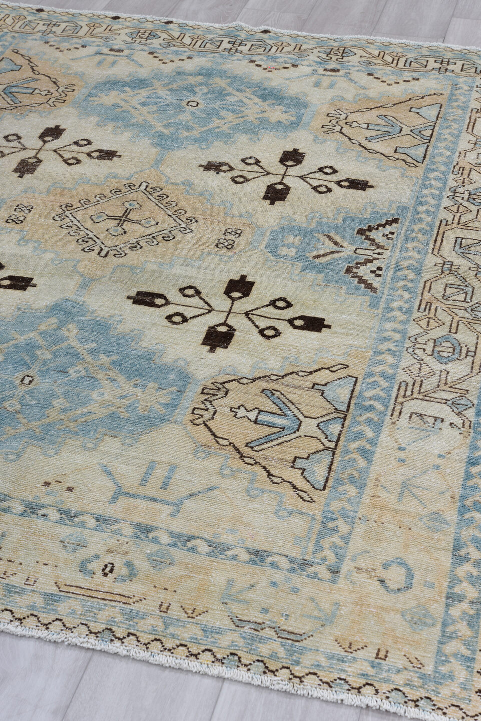 5' x 6' one-of-a-kind handmade antique Baktiary rug. Color palette: ivory, sky blue, camel, brown, taupe, light blue, beige