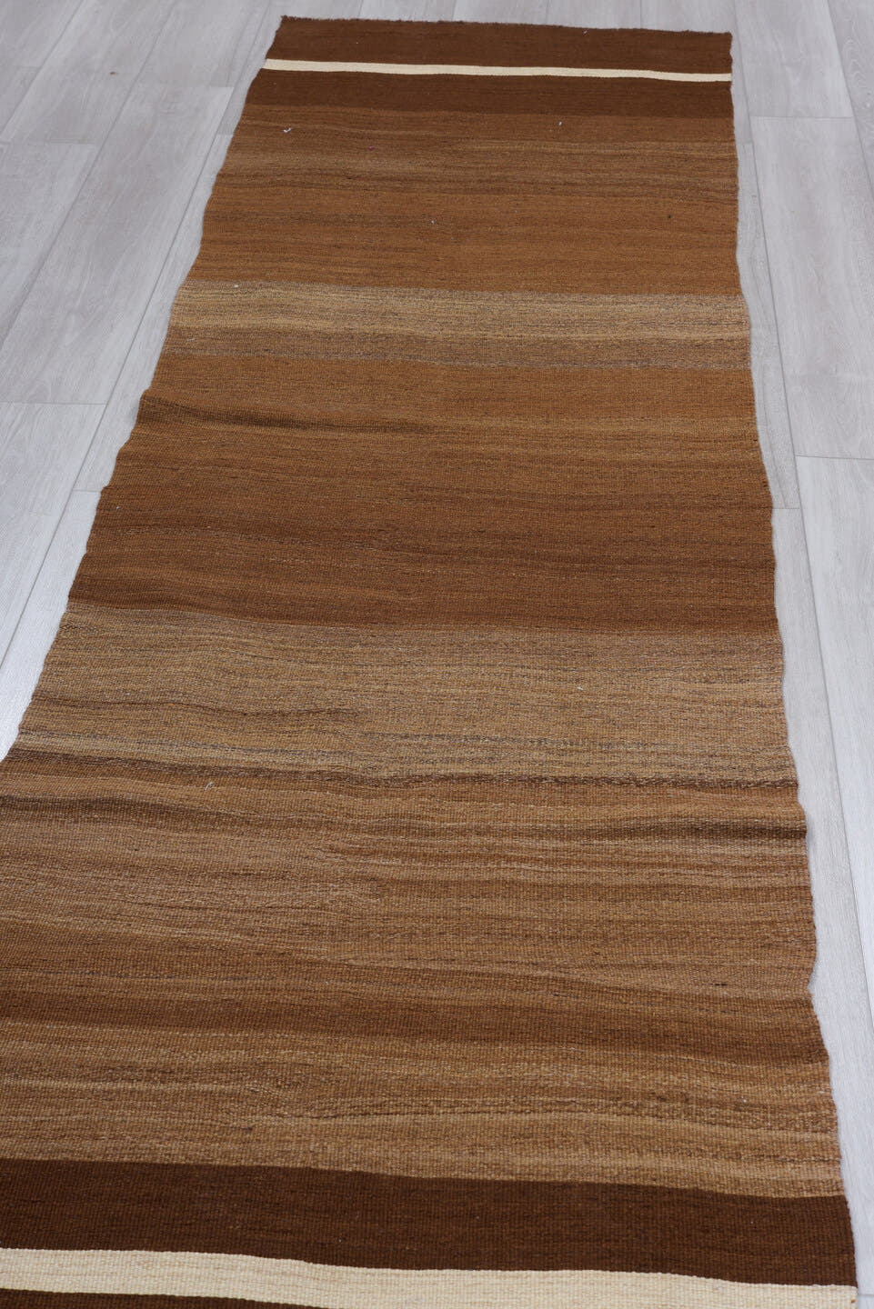 2' x 10' one-of-a-kind handmade vintage Kilim runner rug. Color palette: brown, camel, taupe, ivory, beige, gray