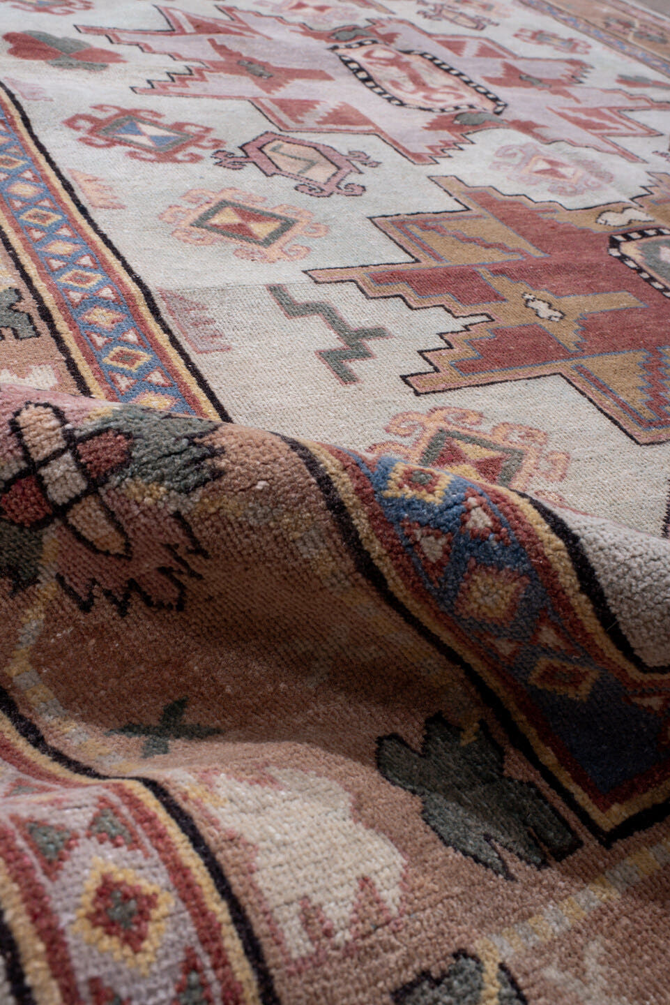 4' x 7' one-of-a-kind handmade antique Khotan rug. Color palette: ivory, camel, rose, dusty blue, sage, rust, taupe, beige