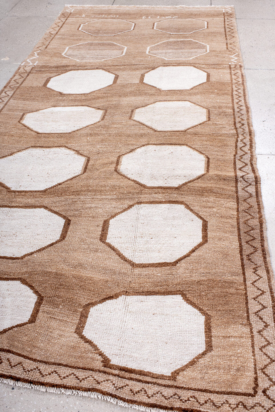 5' x 11' one-of-a-kind handmade antique Kars rug. Color palette: camel, ivory, taupe, brown, beige, gray