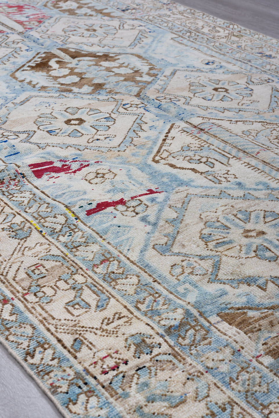 5' x 9' one-of-a-kind handmade antique Baktiary medium size rug. Color palette: ivory, sky blue, camel, brown, rose, crimson