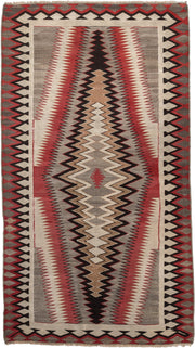 4' x 7' one-of-a-kind handmade vintage Navajo rug. Color palette: ivory, rust, taupe, charcoal, black, camel, terracotta