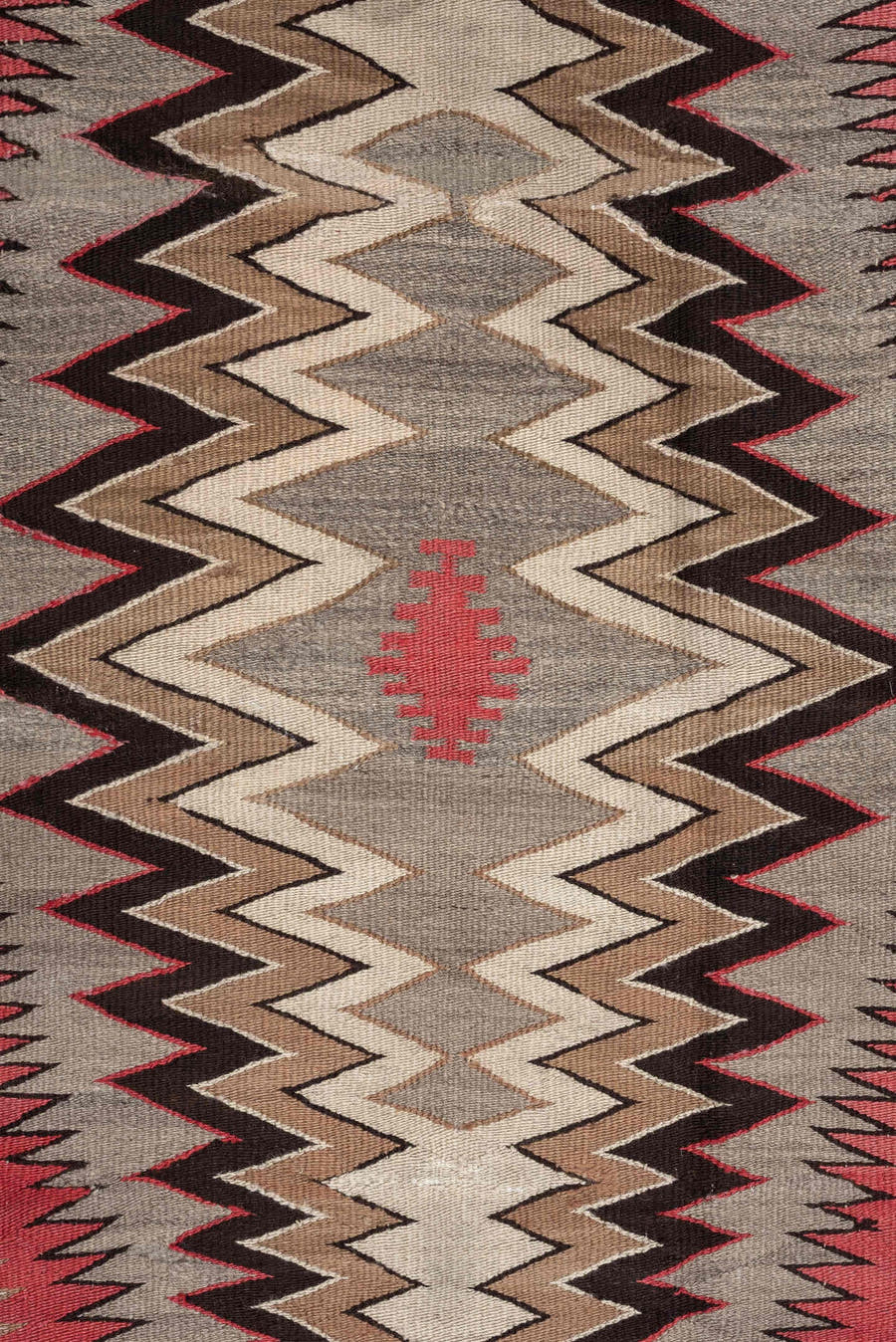 4' x 7' one-of-a-kind handmade vintage Navajo rug. Color palette: ivory, rust, taupe, charcoal, black, camel, terracotta