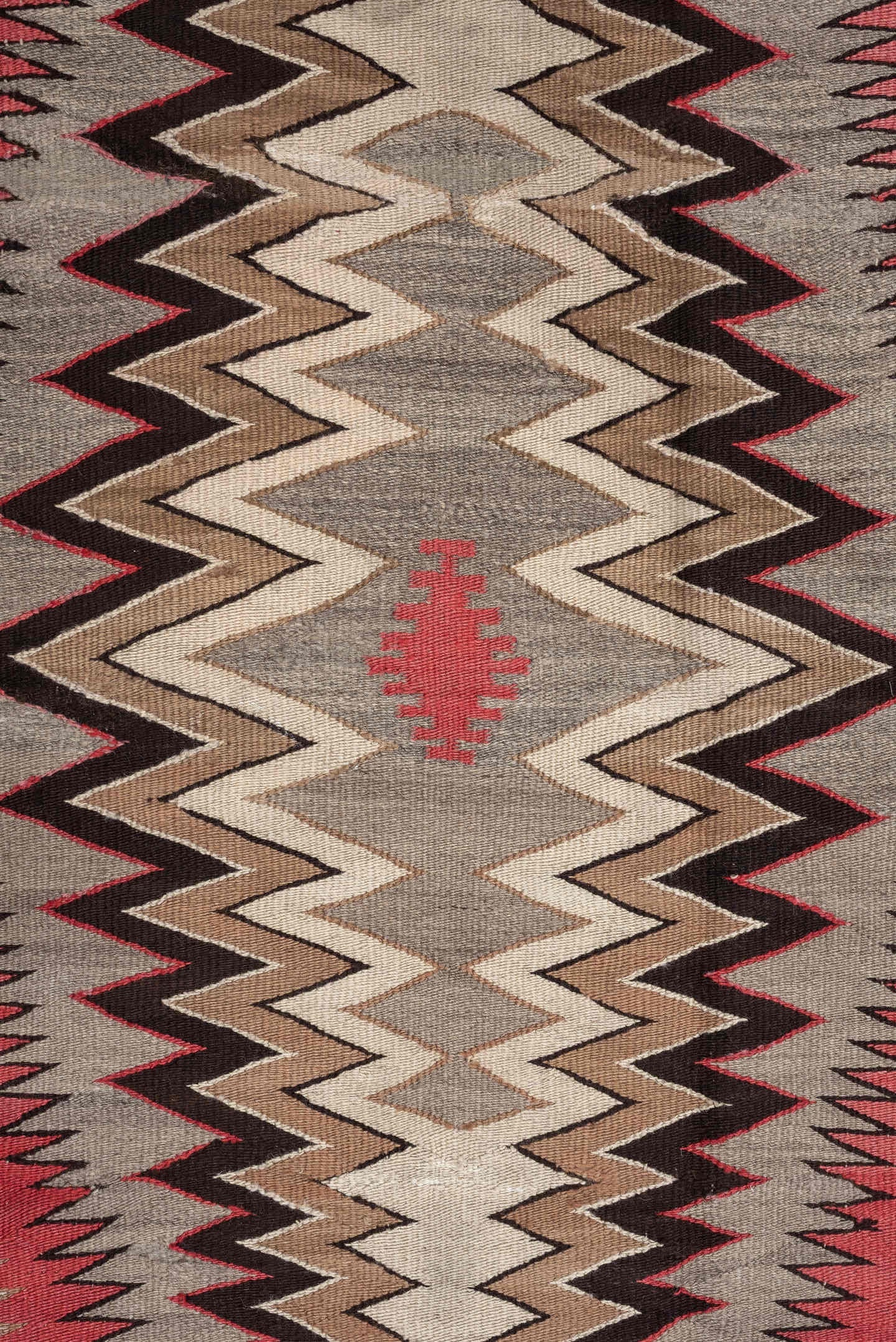 4' x 7' one-of-a-kind handmade vintage Navajo rug. Color palette: ivory, rust, taupe, charcoal, black, camel, terracotta