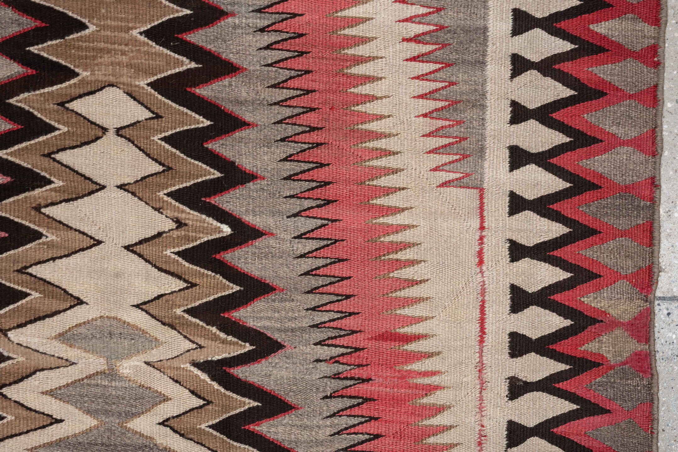 4' x 7' one-of-a-kind handmade vintage Navajo rug. Color palette: ivory, rust, taupe, charcoal, black, camel, terracotta