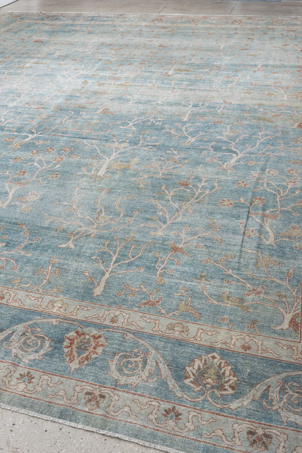 15' x 17' one-of-a-kind handmade antique Laristan oversize rug. Color palette: pale blue, ivory, blush, sage, taupe