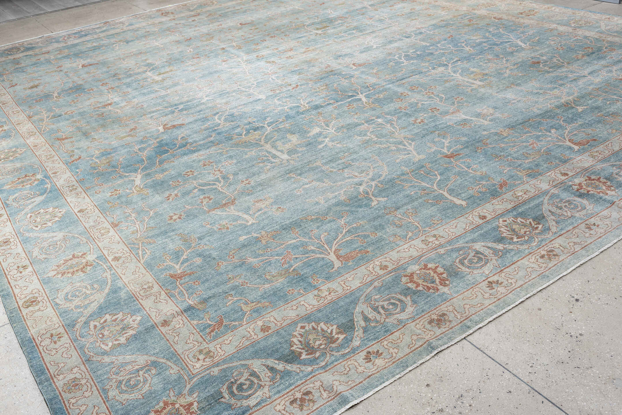 15' x 17' one-of-a-kind handmade antique Laristan oversize rug. Color palette: pale blue, ivory, blush, sage, taupe