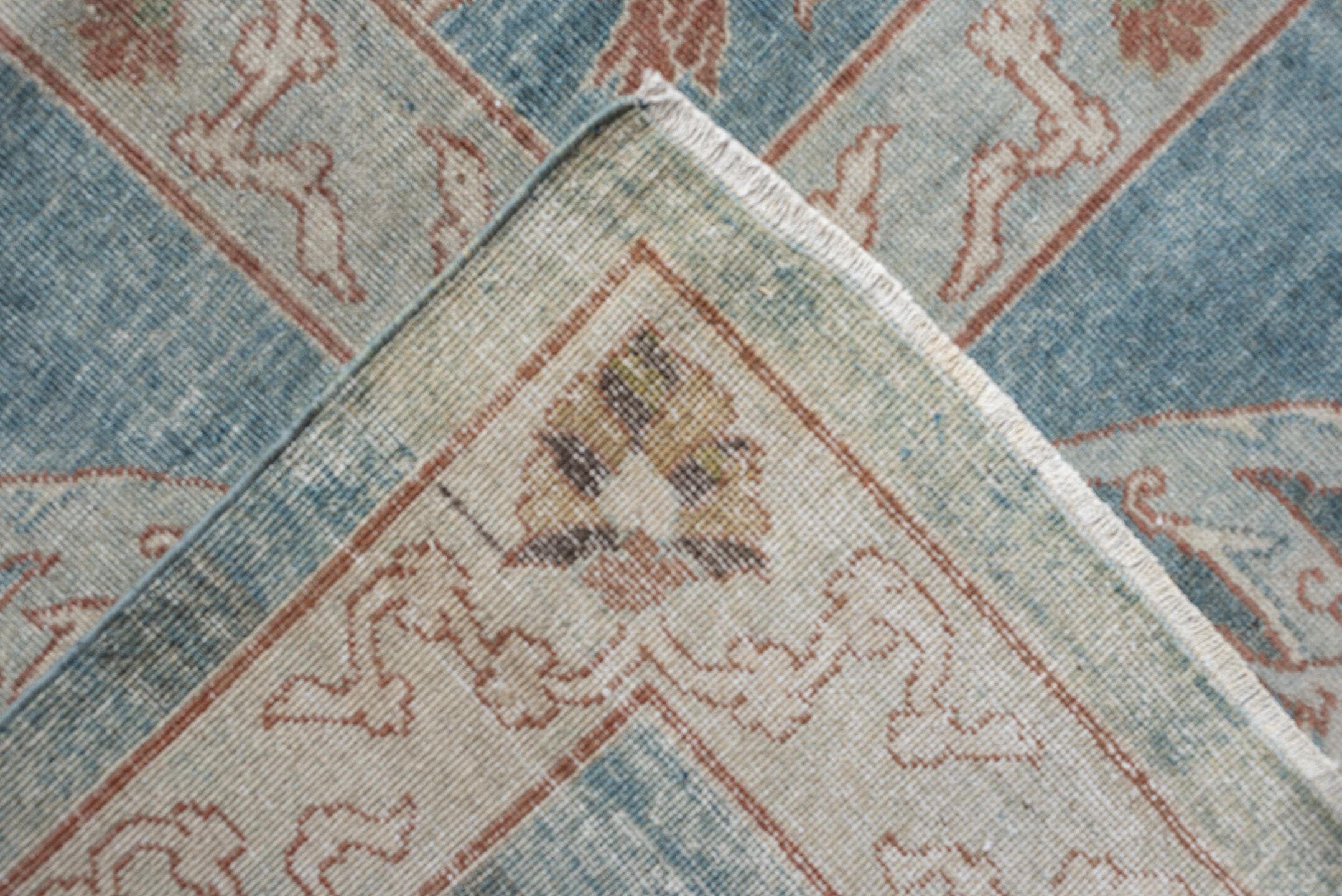 15' x 17' one-of-a-kind handmade antique Laristan oversize rug. Color palette: pale blue, ivory, blush, sage, taupe
