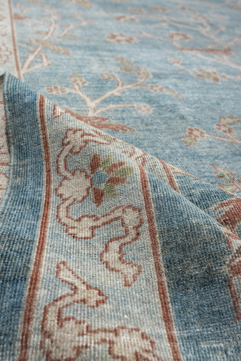 15' x 17' one-of-a-kind handmade antique Laristan oversize rug. Color palette: pale blue, ivory, blush, sage, taupe