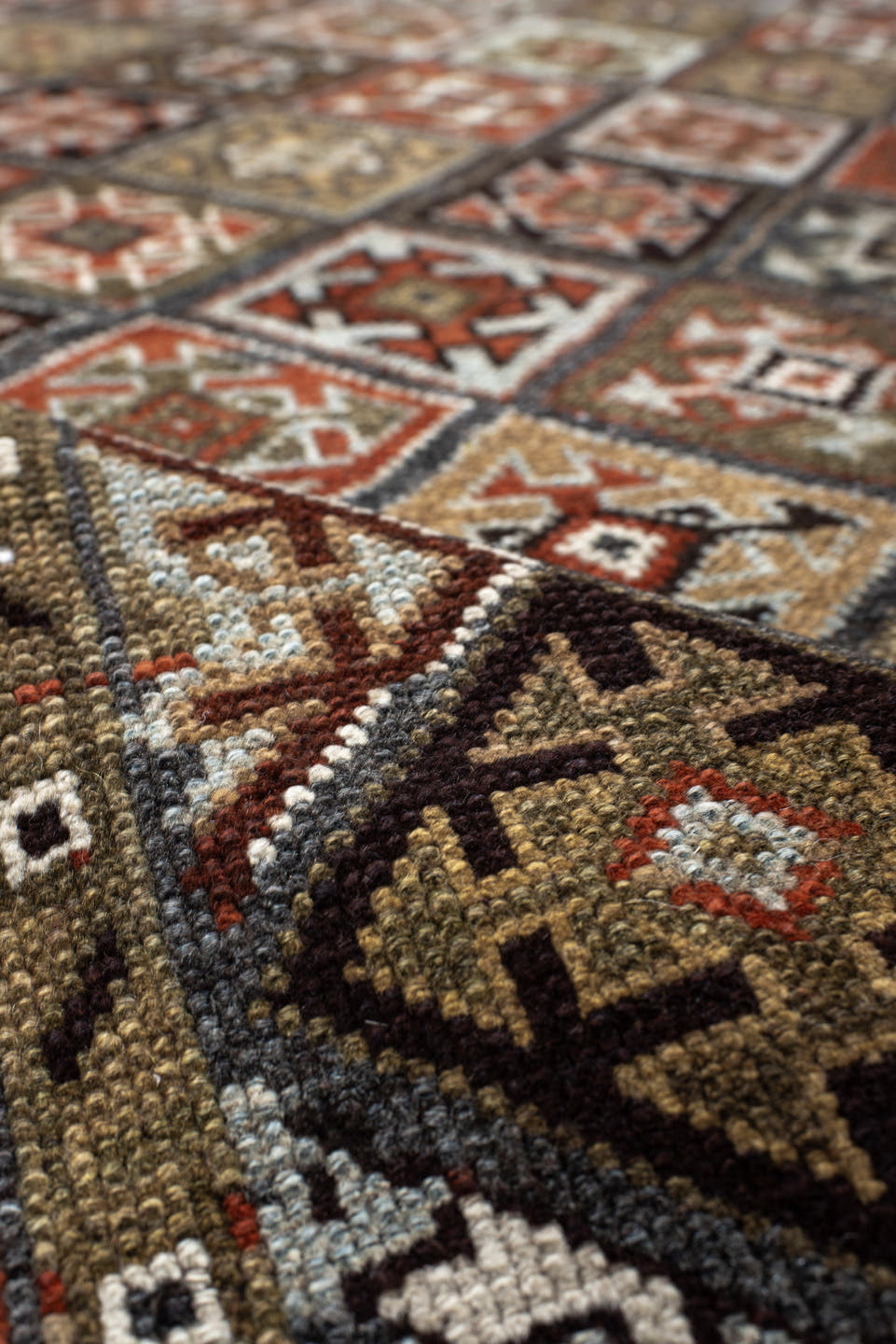 3' x 9' one-of-a-kind handmade antique Kurd runner rug. Color palette: taupe, rust, ivory, brown, charcoal, camel, burgundy