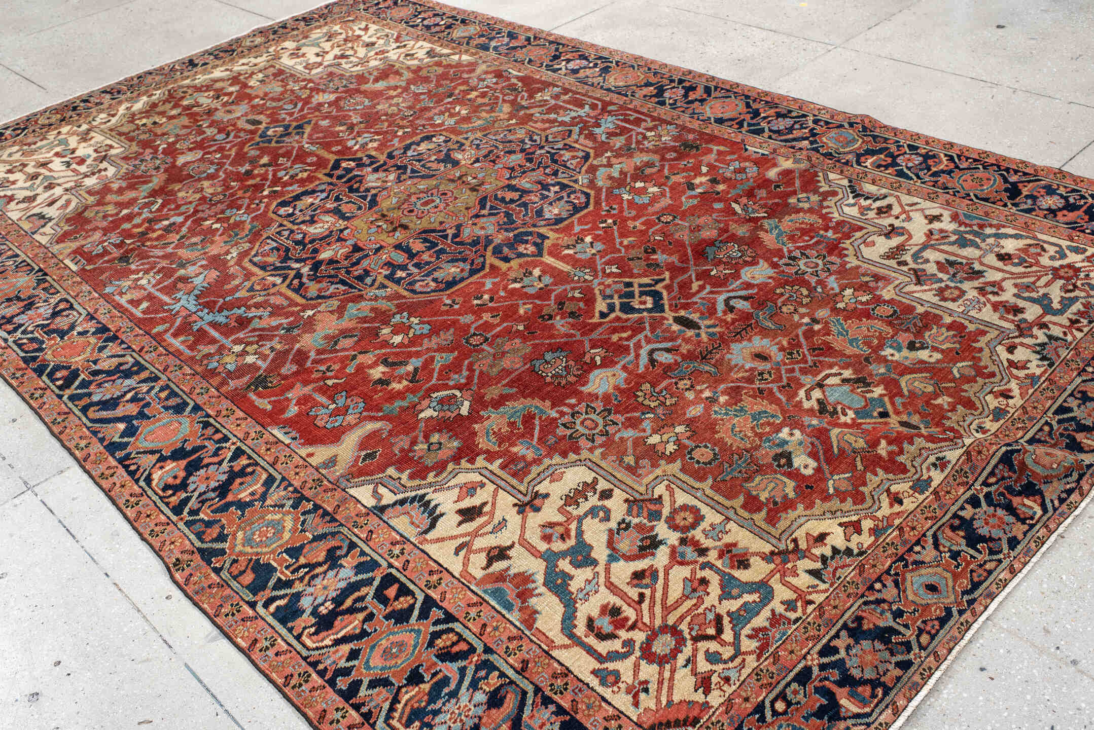 7' x 11' one-of-a-kind handmade antique Heriz large size rug. Color palette: rust, navy, ivory, light_blue, rose, camel