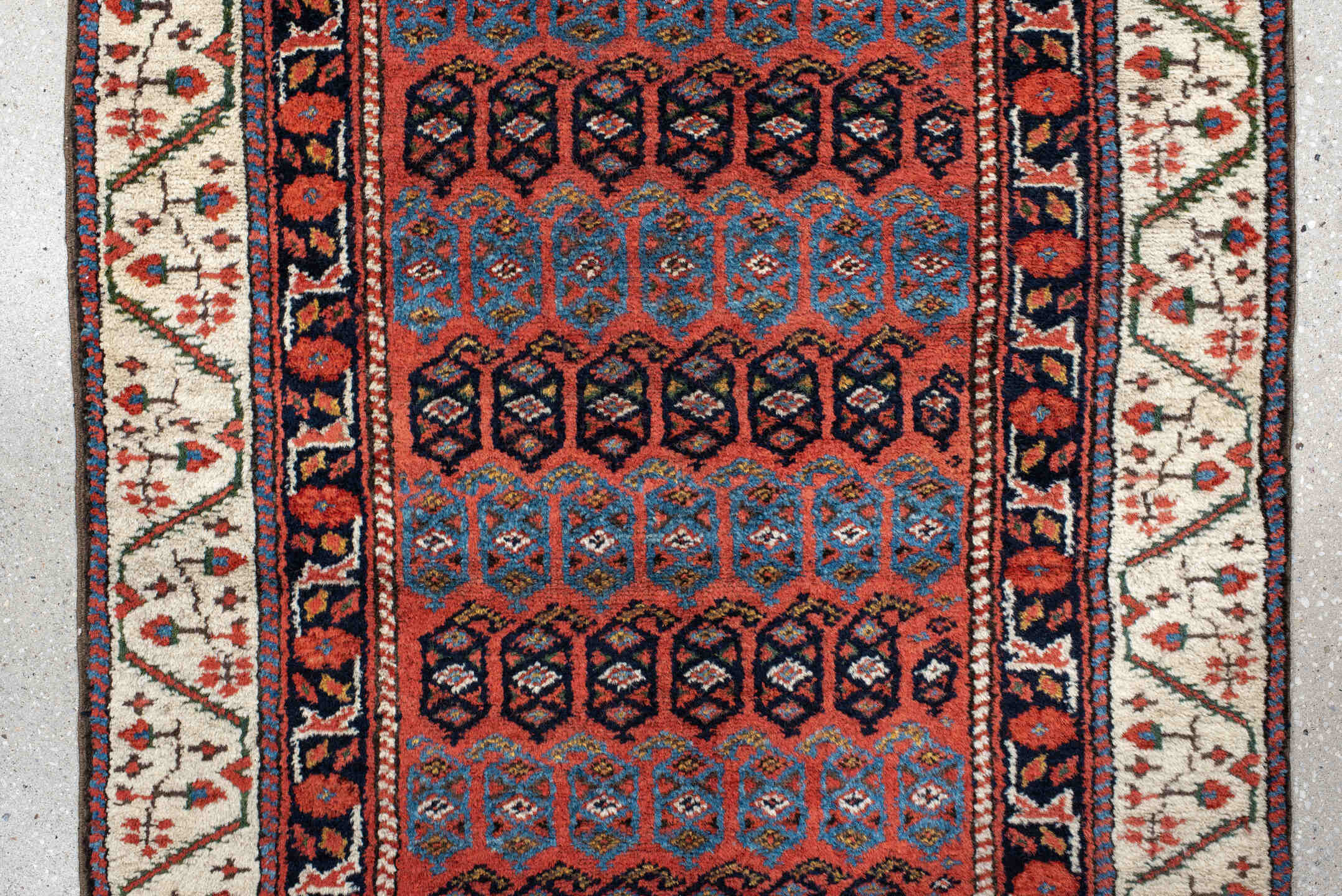 2' x 12' one-of-a-kind handmade vintage NW Persian runner rug. Color palette: black, blue, brown, gray, pink, red, redwood